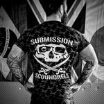 Chris showing off some Submission Scoundrels clothing, with the logo on full display on the back